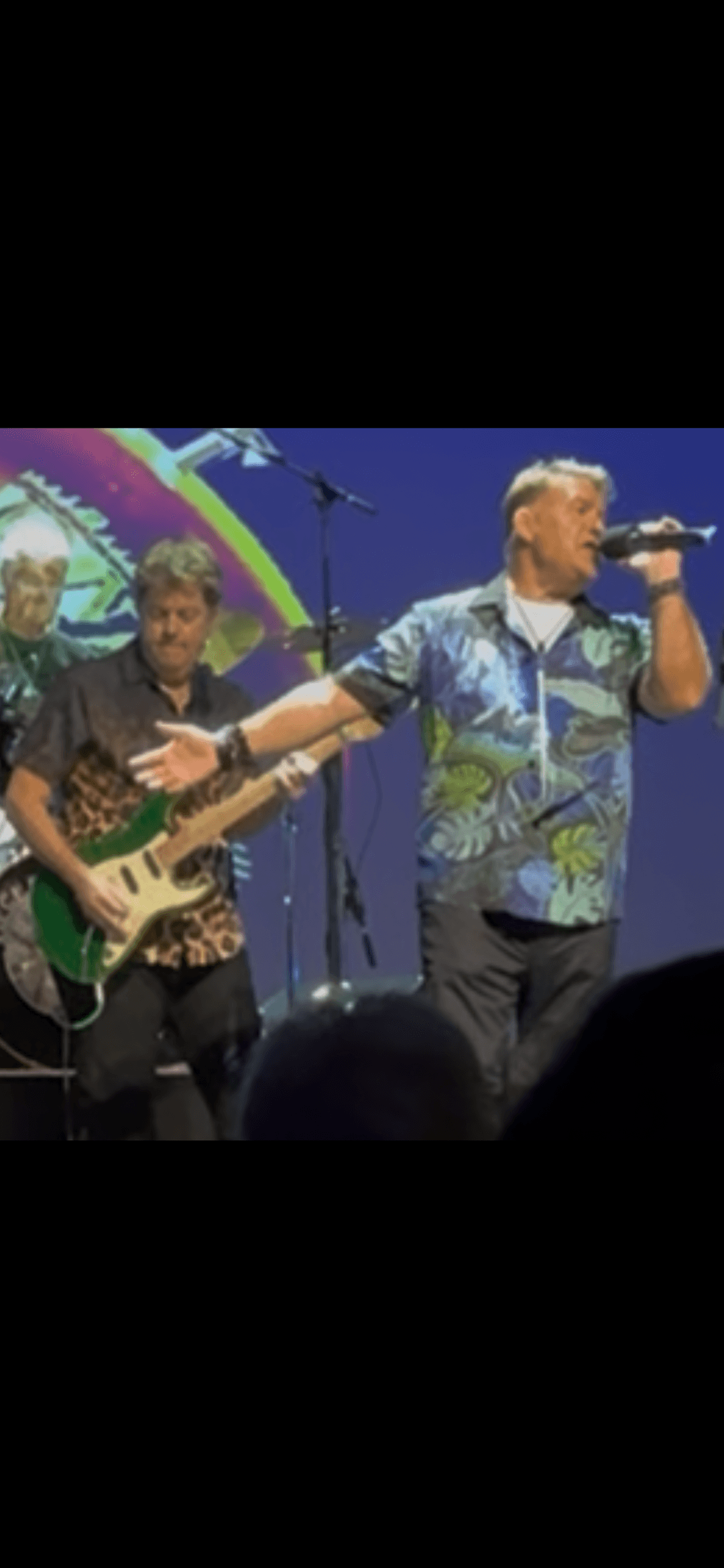 JC Grigg and Keith Howland sharing a moment on stage