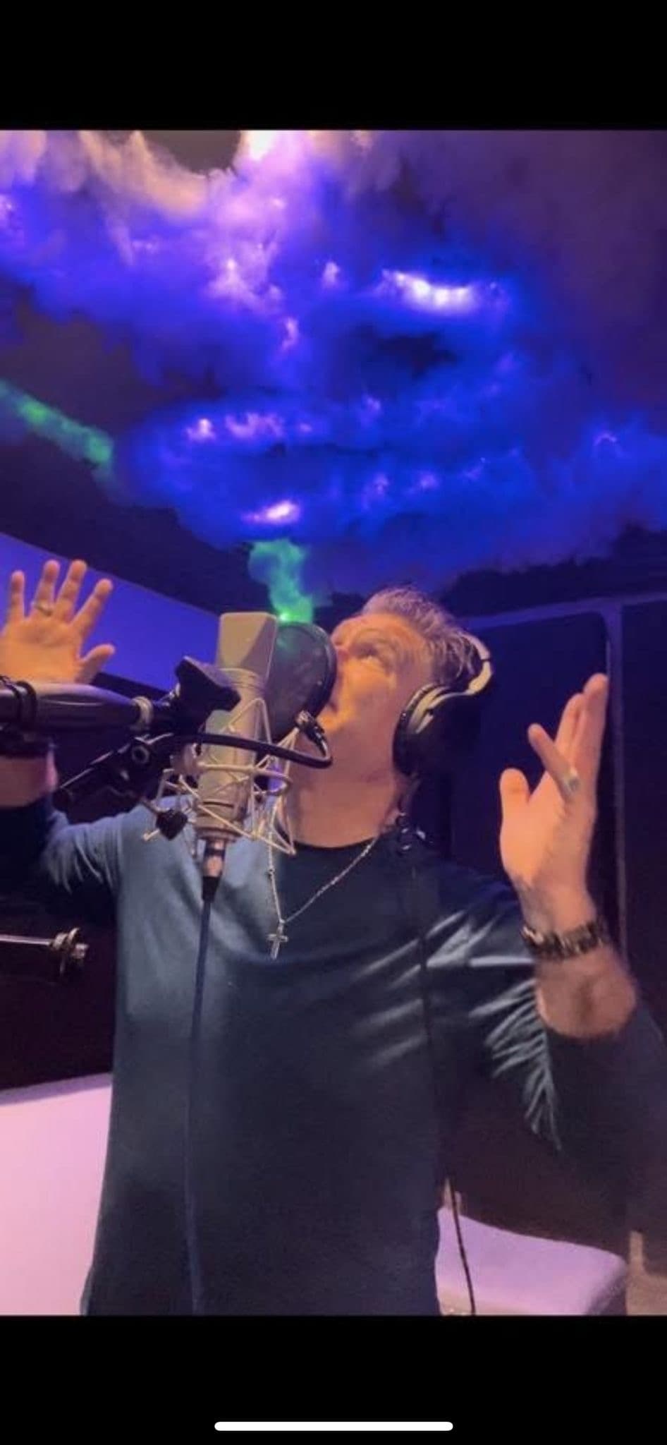 JC Grigg recording in professional studio with LED lighting